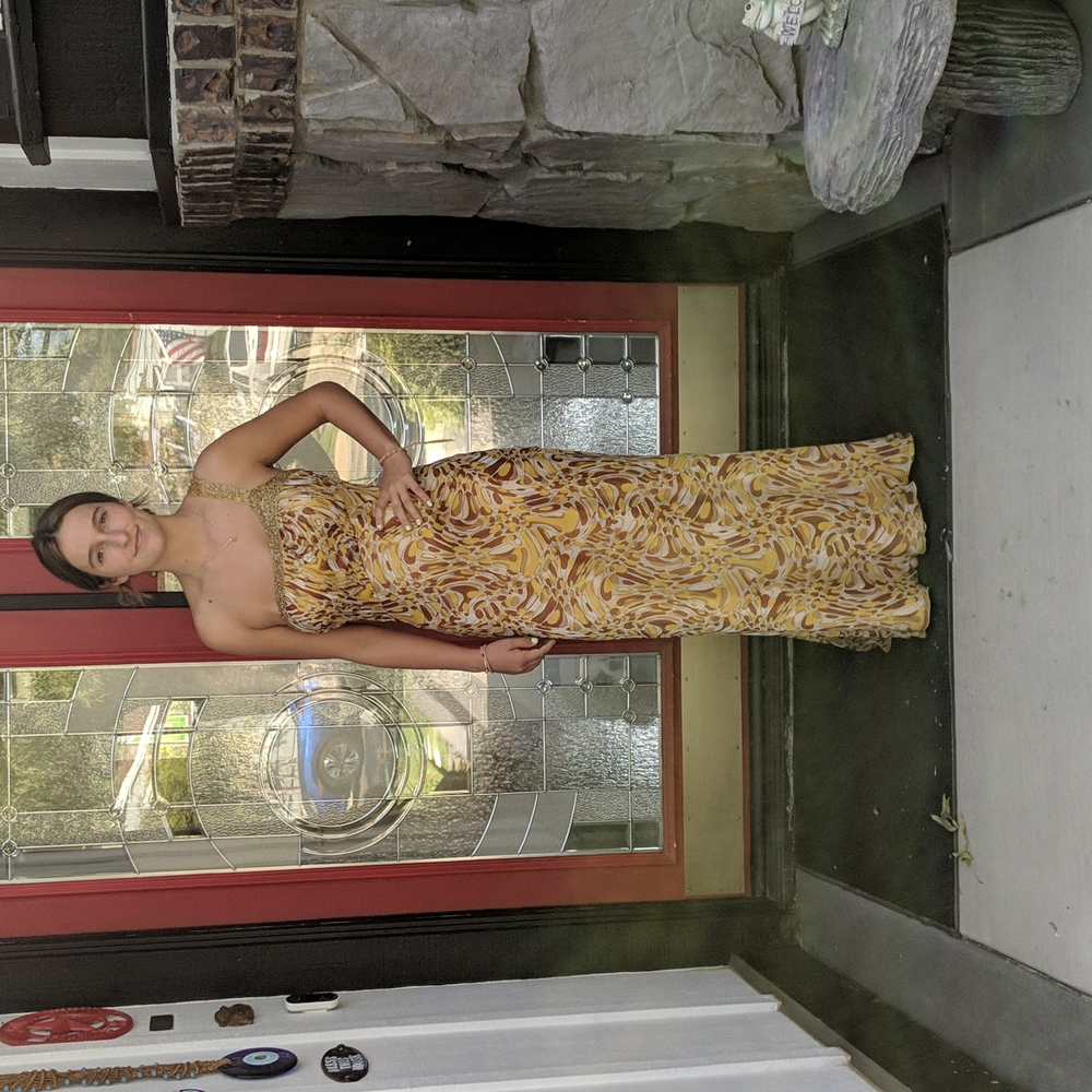 Feminine, one shoulder, long dress with bead work.